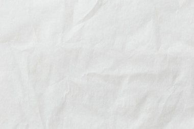 Blank white crumpled and creased paper. White sheet of crumpled paper. Beautiful abstract artistic white empty street poster paper texture pattern