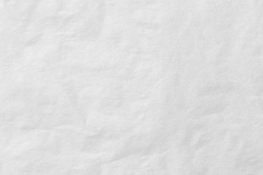 Blank white crumpled and creased paper. White sheet of crumpled paper. Beautiful abstract artistic white empty street poster paper texture pattern