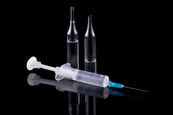 Syringe and glass vial — Stock Photo, Image