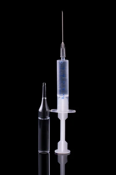 Syringe and glass vial — Stock Photo, Image