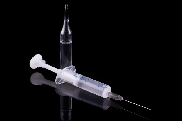 Syringe and glass vial — Stock Photo, Image