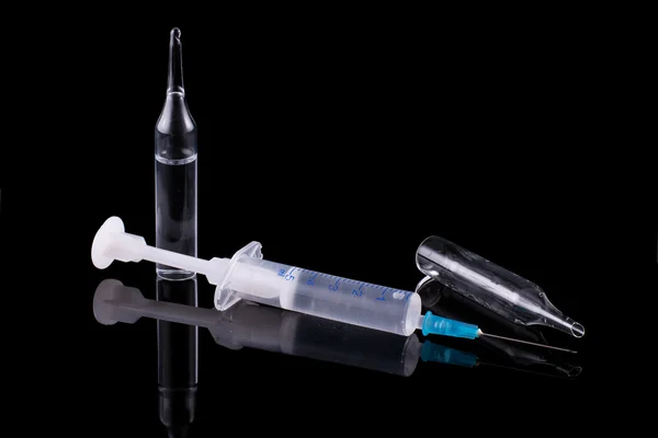 Syringe and glass vial — Stock Photo, Image