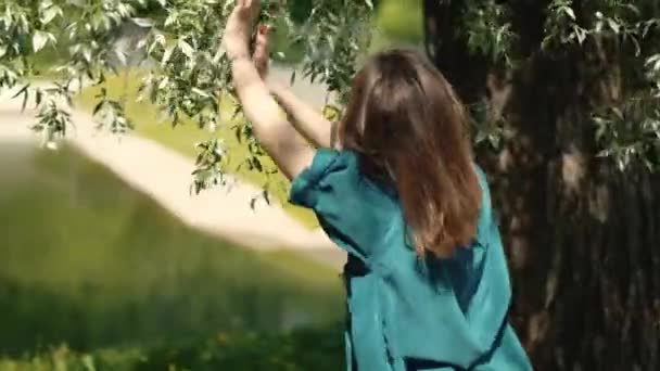Woman Dancing Touching Hands Tree Leaves City Park Real Time — Stock Video