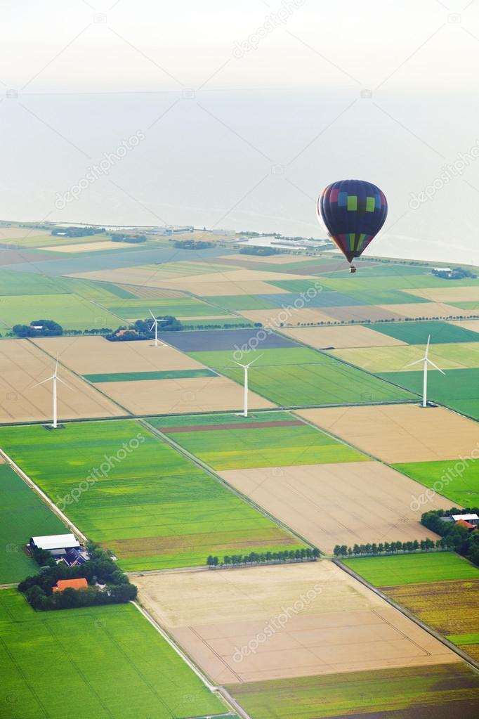 Hot air balloon with Dutch agricultural landscape