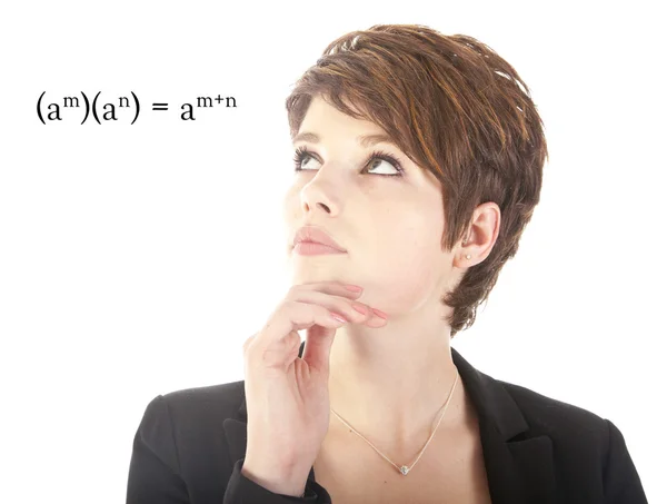 Genç bir kadın beyaz zemin üzerine izole matematik bakarak — Stok fotoğraf