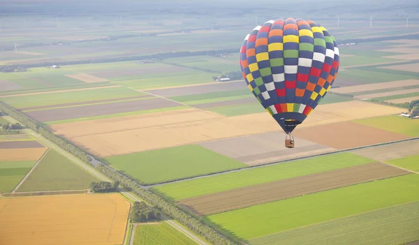 Hot air balloon with green Dutch landscape from above — Stock Photo, Image