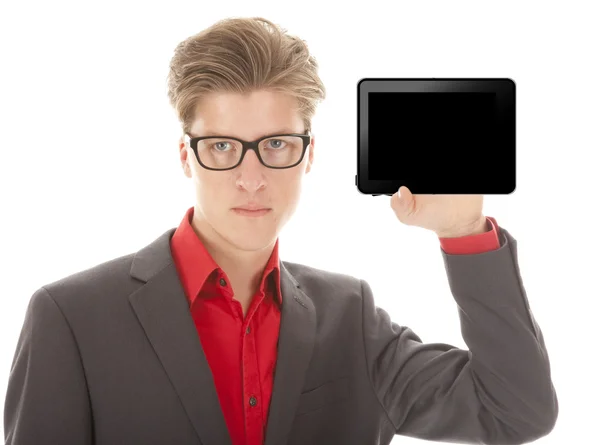 Genç adam beyaz zemin üzerine izole bir mini tablet holding — Stok fotoğraf