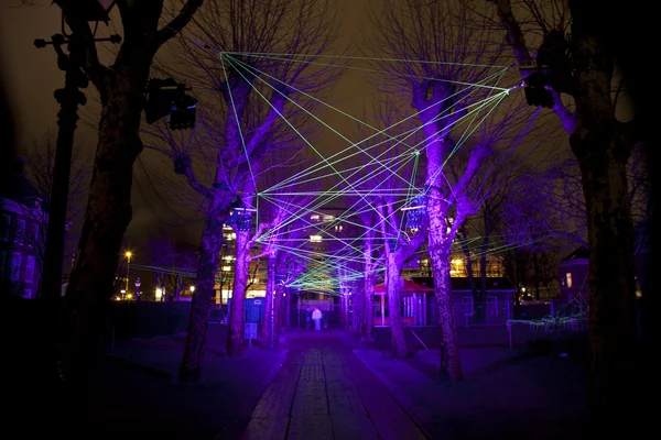 AMSTERDAM, THE NETHERLANDS: Laser show with lights at the annual Amsterdam Light Festival on December 30, 2013. Amsterdam Light Festival - фестиваль зимнего света — стоковое фото