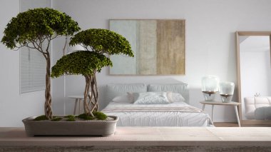 Çakıl taşı ve saksı çiçeği bonsai, yeşil yapraklı klasik ahşap masa rafı yumuşak yataklı çağdaş yatak odası, modern iç tasarım, zen temiz mimari konsept fikri