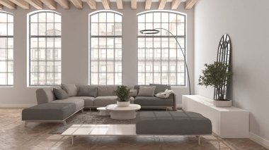 Eski dairede modern oturma odası bej tonlarda büyük eski pencereli, yastıklı, halılı ve masalı büyük kanepeli. Klasik parke döşeme, ahşap çatı kirişleri, iç tasarım fikri.