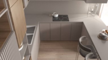 Arka plan bulanık, mutfak modern daire, masa, koltuklar. Lavabo, esrarlı indüksiyon hob, kurabiyeli kahvaltı. Cam masa lambası. Üst görünüm, yukarıda, iç tasarım