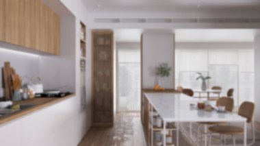 Bulanık arka plan, modern dairede mutfak, tabureli ada, parke. Fırın, ocak, lavabo ve aksesuarlar, tencere ve kahvaltı. Çağdaş iç tasarım kavramı