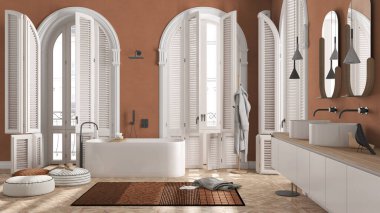 Modern banyo turuncu tonlarda klasik dairede kemerli camlı. Serbest banyo küveti, lavabo, aynalar, halı, havlu ve bornoz dolu raflar. Minimalist iç tasarım