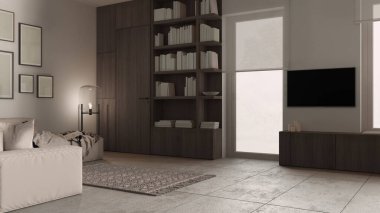 Modern minimalist oturma odası koyu tonlarda, beton fayanslar, kanepe ve halı, zemin cam lamba, çerçeve modeli, ahşap kitaplık ve dolaplar, pencereler, mimari iç tasarım
