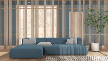 Mavi tonlu minimalist modern oturma odası, yastıklı kadife kanepe, arka planda ahşap panel, halı, parke zemin. Büyük panoramik pencere ve saksı bitkisi. İç tasarım