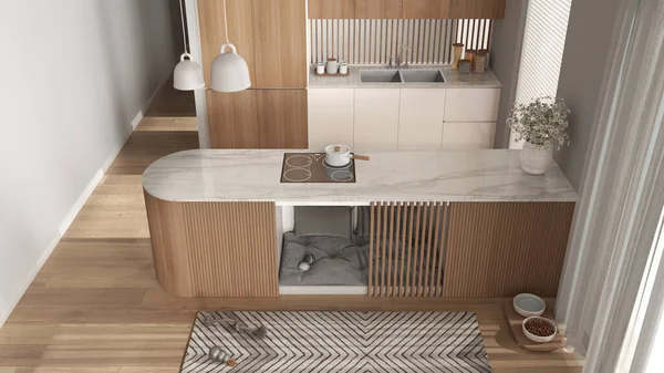 Köpek dostu ahşap ve beyaz mutfak. Yumuşak yastıkları ve oyuncakları olan mobilyaların içindeki köpek yatağı, evcil hayvanlara ayrılmış bir alan. Halı, ikram kasesi, parke. İç tasarım fikri, üst görünüm, yukarıda