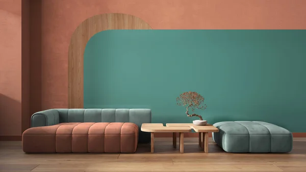 Elegant living room close up in turquoise and orange tones, sofa and pouf, wooden side table with bonsai, concrete walls decor. Parquet floor. Copy space. Contemporary interior design