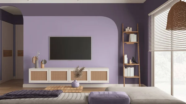 Modern wooden living room in purple tones, velvet sofa with side table, rattan commode with television, ladder shelves with books and decors. Big window with blinds. Interior design