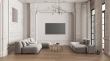 Arka plan bulanık, klasik dairede modern mobilyalar masa ve koltuklu oturma odası, masa ve lambalar. Alçı kaplı duvarlar, parke. Eski iç tasarım