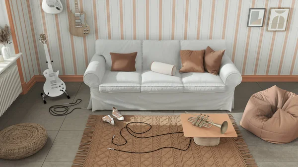 Cozy living room in white and orange tones, striped wallpaper, sofa, bicycle and musical instruments hanging on the wall, carpet and table. Top view, above. Modern interior design