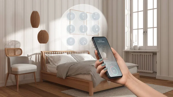 Smart home technology interface on phone app, augmented reality, internet of things, interior design of cozy bedroom with connected objects, woman hand holding remote control device