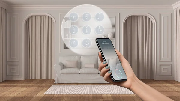 Smart home technology interface on phone app, augmented reality, internet of things, interior design of classic living with connected objects, woman hand holding remote control device