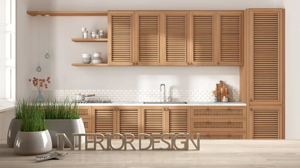 Wooden table, desk or shelf with potted grass plant, house keys and 3D letters making the words interior design, over country wooden kitchen, project concept copy space background