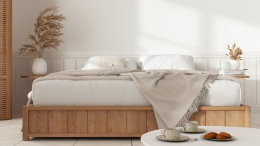 Tahta minimalist yatak odası beyaz tonlarda. Mater yatağı ve battaniyesi fotokopi alanı ile kapatılmış. Parke zemin, çay bardaklı masa, kurabiyeli kahvaltı. İç tasarım