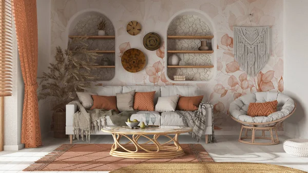 Living room in boho style with wallpaper and parquet. Sofa, jute carpet and rattan armchair in white and orange tones. Bohemian wooden interior design