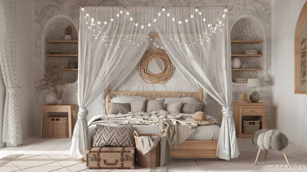 Bohemian bedroom with canopy bed in white and beige tones. Parquet, natural wallpaper and ethnic carpets. Rattan and wooden furniture. Boho style interior design