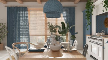 Beyaz ve mavi tonlarda ahşap yemek masası. Mutfak, kolye lambaları ve pencere. İskandinav Boho iç tasarımı