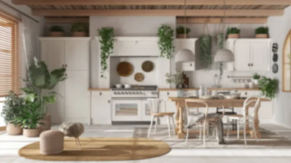 Blurred background, wooden country kitchen.Dining table, carpet and appliances. Scandinavian boho interior design