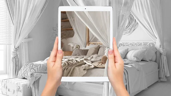 Bohem yatak odasını bohem tarzında gösteren tableti tutan eller, tamamen boş proje geçmişi, artırılmış gerçeklik konsepti, mobilya ve iç tasarım ürünlerini taklit etmek için uygulama