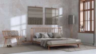 Blurred background, japandi bedroom with macrame wall art. Wooden furniture, carpets and double bed. Wabi sabi interior design