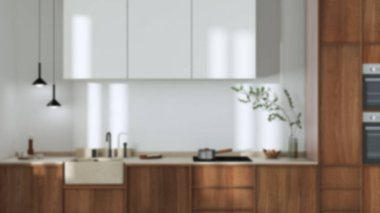 Blurred background, japandi trendy wooden kitchen. Wooden cabinets, contemporary wallpaper and marble top. Minimalist interior design