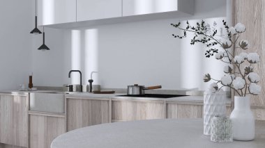Japandi trendy wooden kitchen and dining room in white and bleached tones. Close up on table with cotton flowers, wallpaper, cabinets and marble top. Minimalist interior design