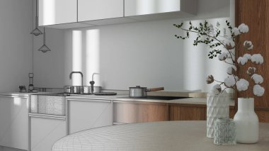 Architect interior designer concept: hand-drawn draft unfinished project that becomes real, japandi trendy wooden kitchen and dining room. Close up on table with cotton flowers