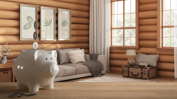 Wooden table top or shelf with white piggy bank with coins, log cabin wooden living room, expensive home interior design, renovation restructuring concept architecture