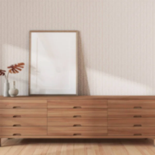 Blurred background, living room close-up with frame mockup. Wooden chest of drawers. Farmhouse interior design