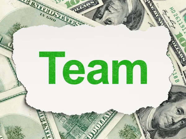 Torn paper with words Team on money background — Stock Photo, Image