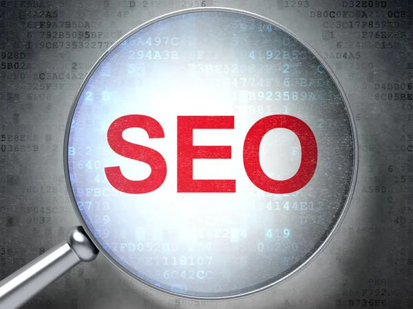 Sviluppo Web Concetto SEO: vetro ottico con parole SEO — Foto Stock