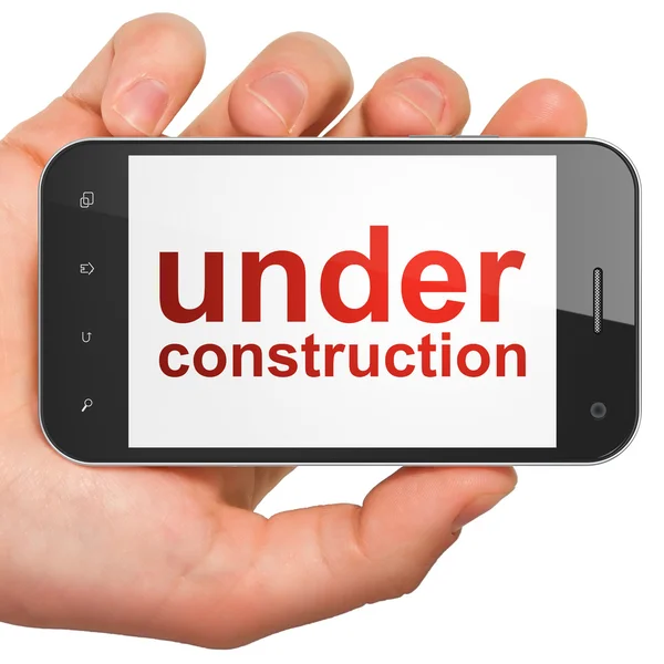 Web design SEO concept : smartphone avec en construction — Photo