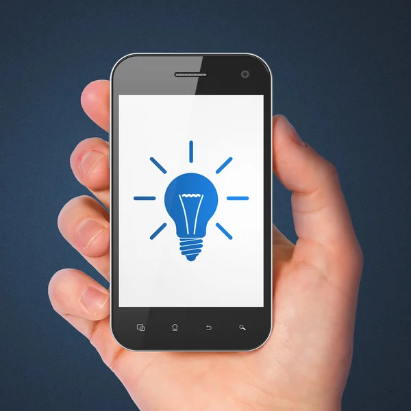 Concetto di finanza: smartphone con lampadina . — Foto Stock