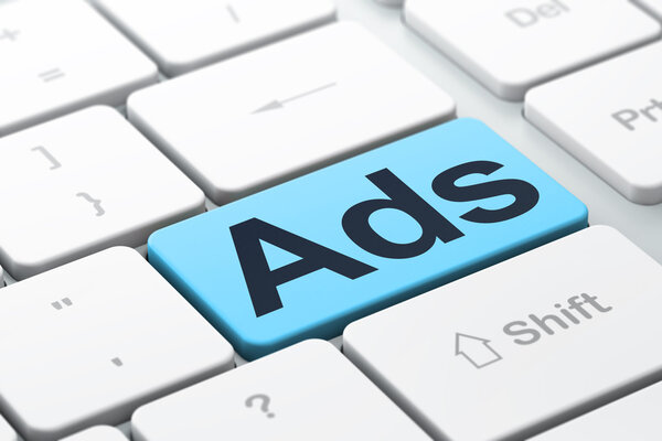 Advertising concept: Ads on computer keyboard background