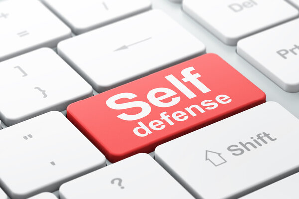 Safety concept: Self Defense on computer keyboard background