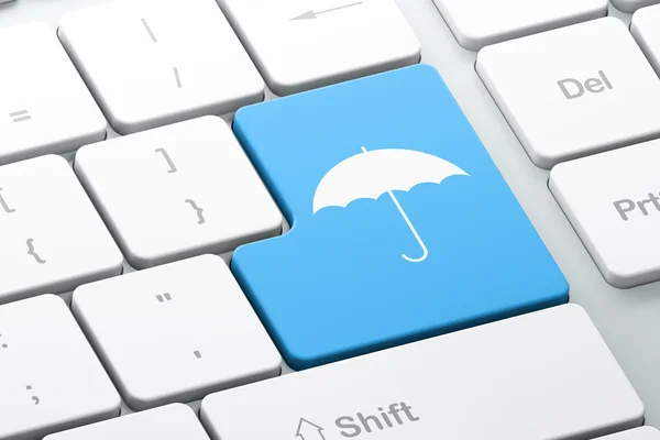 Datenschutz-Konzept: Regenschirm auf Computertastatur-Hintergrund — Stockfoto