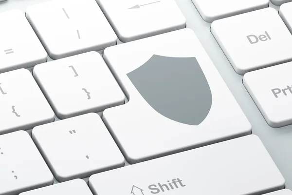 Veiligheidsconcept: Shield op computer toetsenbord achtergrond — Stockfoto