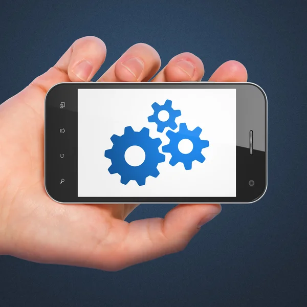 Web ontwikkelingsconcept: Gears op smartphone — Stockfoto