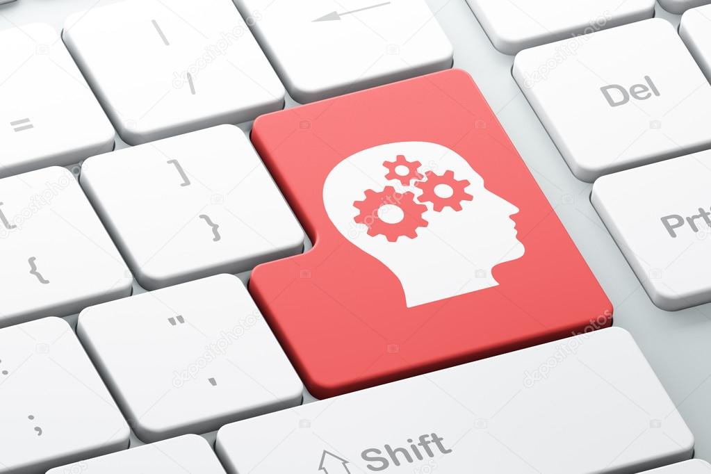 Business concept: Head With Gears on computer keyboard backgroun