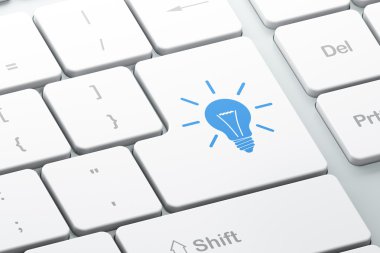 Business concept: Light Bulb on computer keyboard background clipart
